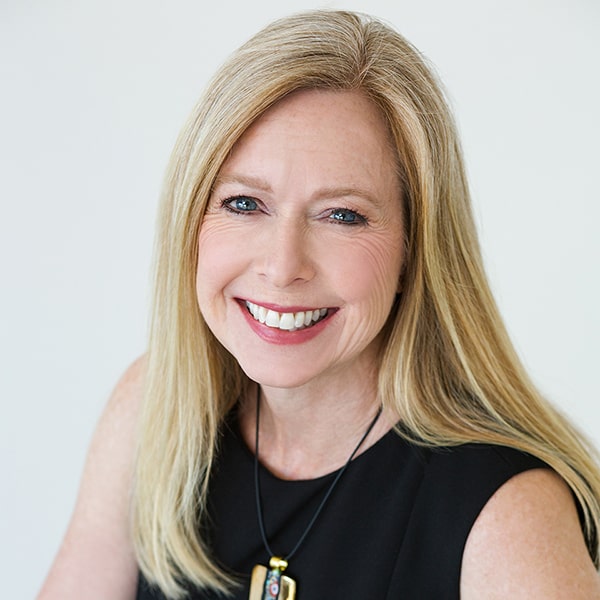 Press With Bridget Grimes, CFP® Headshot 1 With Gold Necklace