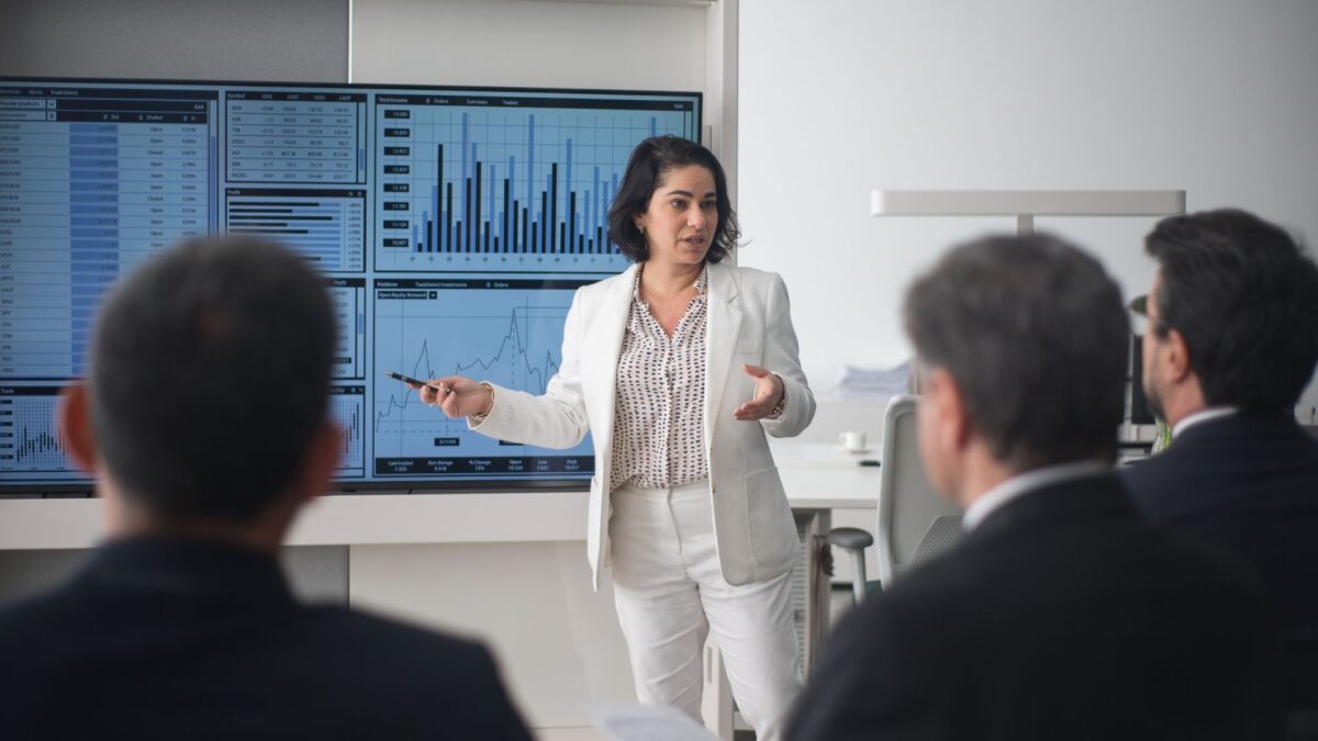 Woman in finance teaching about the stock market