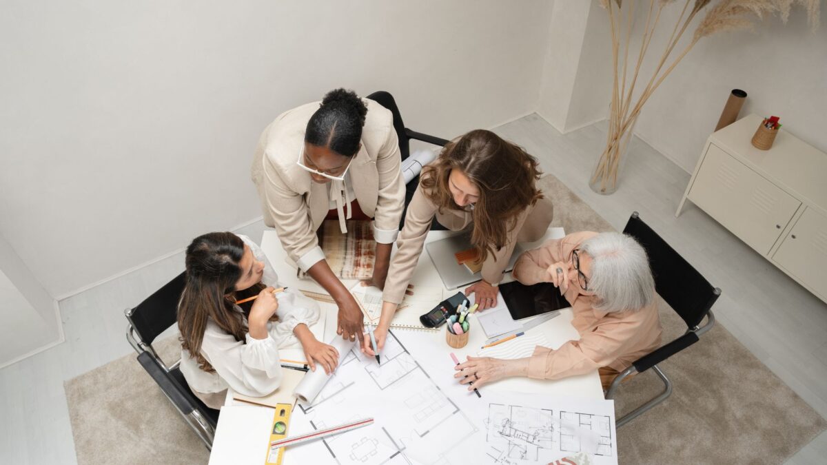 Image of woman planning for their entrepreneurial journey around a table