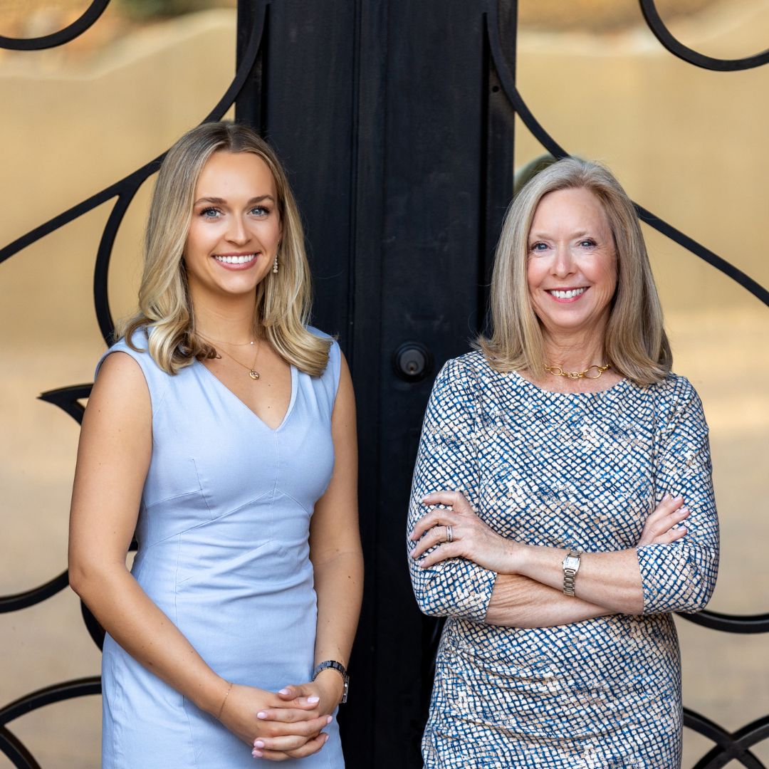 Marnie and Bridget standing next to each other, the mother daughter duo who run WealthChoices.