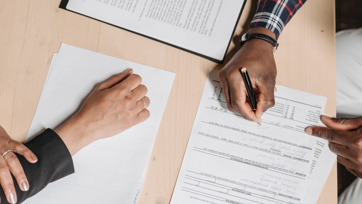 A couple looking over the paperwork for a prenup agreement
